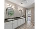 Bathroom featuring a double sink vanity, tile floors, updated lights, and access to the main bedroom at 3452 Hard Creek Ln, Buford, GA 30519