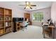 Bedroom featuring carpet, neutral paint, a window, and a desk and bookshelves at 3452 Hard Creek Ln, Buford, GA 30519
