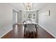 Bright dining area with a bay window, modern chandelier, and seating for four, ideal for entertaining at 3452 Hard Creek Ln, Buford, GA 30519