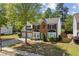 Attractive two-story house featuring a well-maintained lawn, brick facade, and attached two-car garage at 3452 Hard Creek Ln, Buford, GA 30519