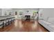 Bright living room featuring hardwood floors, a cozy fireplace, and comfortable seating at 3452 Hard Creek Ln, Buford, GA 30519