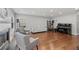 Spacious living room with hardwood floors, fireplace, and abundant natural light at 3452 Hard Creek Ln, Buford, GA 30519