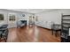 Spacious living room with hardwood floors, a fireplace, and plenty of natural light from the windows at 3452 Hard Creek Ln, Buford, GA 30519