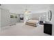 Spacious main bedroom with large bed, TV, dresser, seating area, and large windows at 3452 Hard Creek Ln, Buford, GA 30519