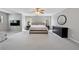 Spacious main bedroom with large bed, TV, dresser, and large windows for natural light at 3452 Hard Creek Ln, Buford, GA 30519
