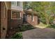 Landscaped backyard with brick exterior at 629 Pinetree Dr, Decatur, GA 30030