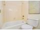 Clean and simple bathroom with a tiled tub and shower, and classic fixtures at 629 Pinetree Dr, Decatur, GA 30030
