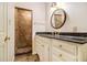 Bathroom boasts a granite countertop, stylish vanity, and tile shower enclosure at 629 Pinetree Dr, Decatur, GA 30030