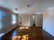 Bedroom featuring hardwood floors, natural light, and doorways to other rooms at 629 Pinetree Dr, Decatur, GA 30030