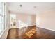 Bedroom featuring hardwood floors, natural light, and attached bath at 629 Pinetree Dr, Decatur, GA 30030