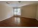 Bedroom with gleaming hardwood floors and sun-filled window at 629 Pinetree Dr, Decatur, GA 30030