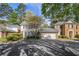 Charming two-story home with attached garage and mature trees at 629 Pinetree Dr, Decatur, GA 30030