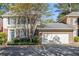 Charming two-story home with attached garage and blue shutters at 629 Pinetree Dr, Decatur, GA 30030