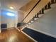 Inviting foyer features hardwood floors, and a staircase with white railings at 629 Pinetree Dr, Decatur, GA 30030