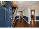 Inviting foyer with hardwood floors and staircase with craftsman details at 629 Pinetree Dr, Decatur, GA 30030