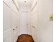 Hallway with hardwood floors features lots of storage and easy access to rooms at 629 Pinetree Dr, Decatur, GA 30030