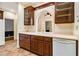 Bright kitchen with custom cabinets, tile floors, arched window, and modern appliances at 629 Pinetree Dr, Decatur, GA 30030