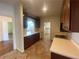 Well-maintained kitchen with tile floors, abundant storage, and views to other rooms at 629 Pinetree Dr, Decatur, GA 30030
