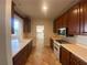 Traditional kitchen featuring ample cabinetry and counter space, tile floors, and modern appliances at 629 Pinetree Dr, Decatur, GA 30030