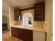 Cozy kitchen showcasing wooden cabinets and unique design with an archway looking into the next room at 629 Pinetree Dr, Decatur, GA 30030
