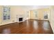 Spacious living room with hardwood floors and fireplace with white mantle at 629 Pinetree Dr, Decatur, GA 30030