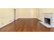 Expansive living room with hardwood floors and cozy fireplace at 629 Pinetree Dr, Decatur, GA 30030