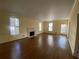 Large and airy living room with a fireplace, windows, and hardwood flooring that offer a welcoming space at 629 Pinetree Dr, Decatur, GA 30030