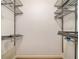 An organized walk-in closet with metal shelving for efficient storage and clear visibility of belongings at 629 Pinetree Dr, Decatur, GA 30030