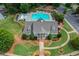Aerial view of a community pool, clubhouse and playground, complete with lush landscaping and ample seating at 114 Oakview Psge, Canton, GA 30114