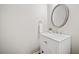 Stylish bathroom with white vanity, marble countertop, and round mirror at 114 Oakview Psge, Canton, GA 30114