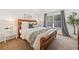 Cozy bedroom with a wooden sleigh bed, plush carpet, and natural light at 114 Oakview Psge, Canton, GA 30114