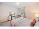 Bright bedroom showcasing a spindle bed frame and neutral tones at 114 Oakview Psge, Canton, GA 30114
