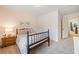 Comfortable bedroom featuring a spindle bed frame and soft pink walls at 114 Oakview Psge, Canton, GA 30114