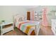 Charming ' bedroom with colorful rainbow bedding and pink curtains at 114 Oakview Psge, Canton, GA 30114