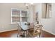Cozy dining area filled with natural light, adjacent to the kitchen and backyard access at 114 Oakview Psge, Canton, GA 30114