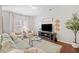 Comfortable living room with hardwood floors and neutral decor, ideal for relaxation at 114 Oakview Psge, Canton, GA 30114