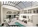 Aerial view of the home's bright atrium with skylights and multi-level balconies at 3511 Roxboro Ne Rd, Atlanta, GA 30326