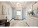 Elegant bathroom features marble floors, double shower, double vanity, and a chair at 3511 Roxboro Ne Rd, Atlanta, GA 30326