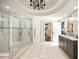 Spacious bathroom showcases marble floors, a dual-head shower and a stylish vanity at 3511 Roxboro Ne Rd, Atlanta, GA 30326