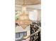 Close up view of the large chandelier with iron stair railings and large windows at 3511 Roxboro Ne Rd, Atlanta, GA 30326