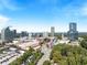 Breathtaking aerial shot of the city skyline with vibrant trees and lush foliage at 3511 Roxboro Ne Rd, Atlanta, GA 30326