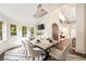 Bright dining area features large windows, an elegant chandelier, and a doorway leading to another room at 3511 Roxboro Ne Rd, Atlanta, GA 30326