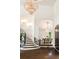 Open entryway with a chandelier, staircase, and view of the dining room at 3511 Roxboro Ne Rd, Atlanta, GA 30326