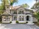 Stunning two-story home with a grand entrance, balcony, and manicured landscaping at 3511 Roxboro Ne Rd, Atlanta, GA 30326
