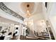 Spacious foyer featuring high ceilings, a grand staircase, a large chandelier, and elegant architectural details at 3511 Roxboro Ne Rd, Atlanta, GA 30326