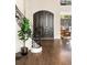 Elegant foyer with hardwood floors, grand staircase, and ornate wrought iron details at 3511 Roxboro Ne Rd, Atlanta, GA 30326
