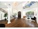 Stately foyer with hardwood floors, curved staircase, and chandelier at 3511 Roxboro Ne Rd, Atlanta, GA 30326