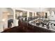 Elegant hallway with hardwood floors, detailed iron railings, and views to multiple rooms and living spaces at 3511 Roxboro Ne Rd, Atlanta, GA 30326