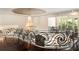 A view from the hallway featuring a chandelier and elegant architectural design with iron railings and dark hardwood floors at 3511 Roxboro Ne Rd, Atlanta, GA 30326