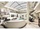 Expansive interior featuring a unique ceiling, railings, an indoor pool, and sitting areas at 3511 Roxboro Ne Rd, Atlanta, GA 30326
